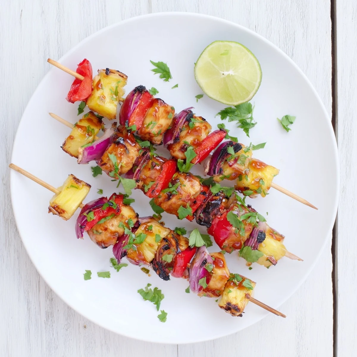 Savory chicken and sweet pineapple chunks threaded on skewers brushed with smoky BBQ sauce