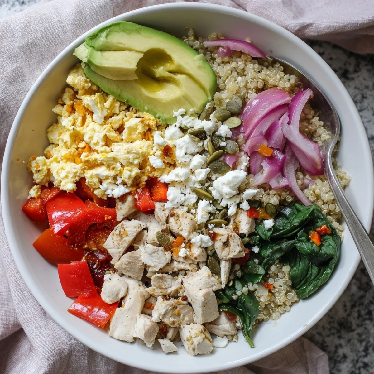 Hearty easy high protein breakfast bowl topped with cottage cheese, spinach, and pumpkin seed crunch