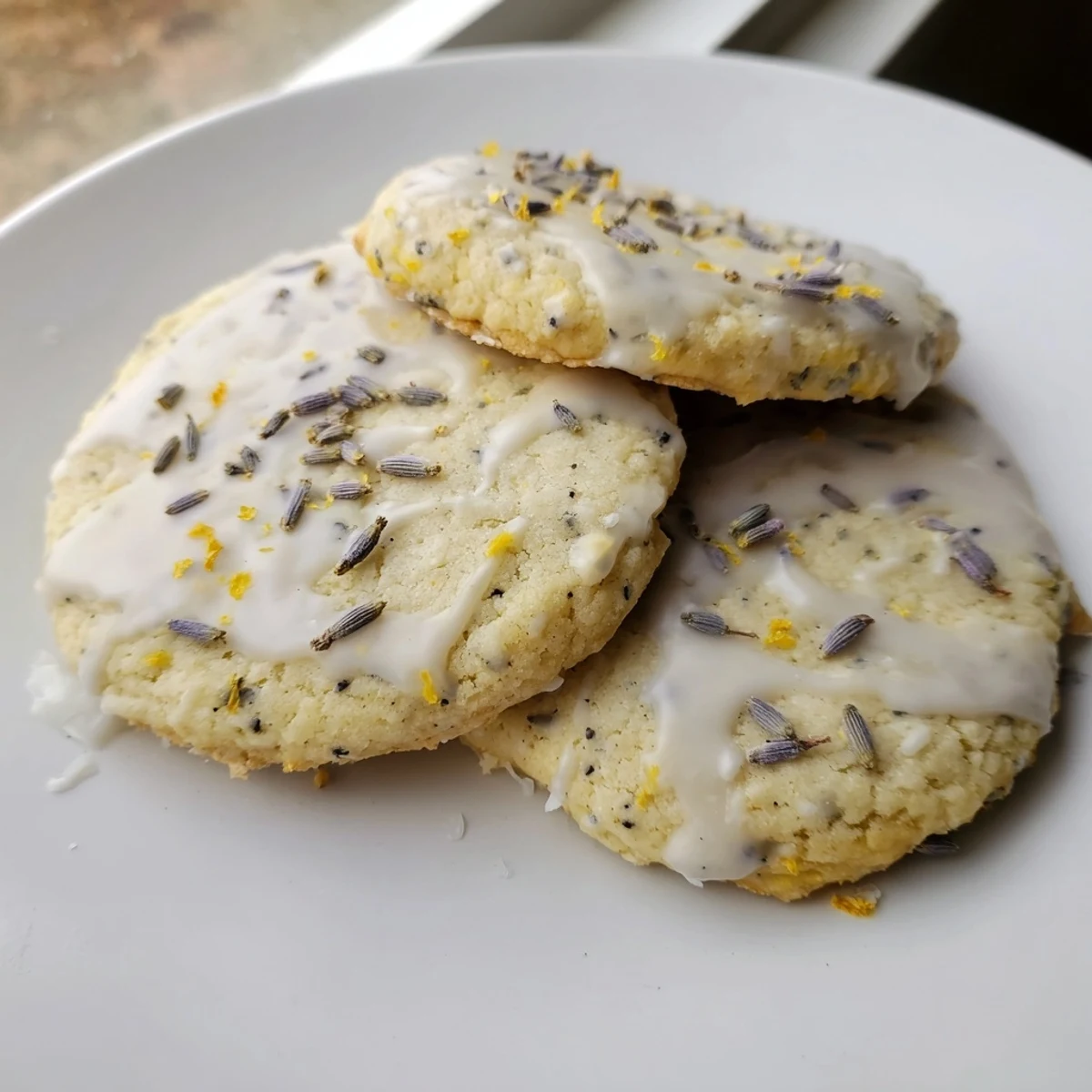 Chewy Lemon Lavender Cookies drizzled with sweet citrus glaze on a wire cooling rack