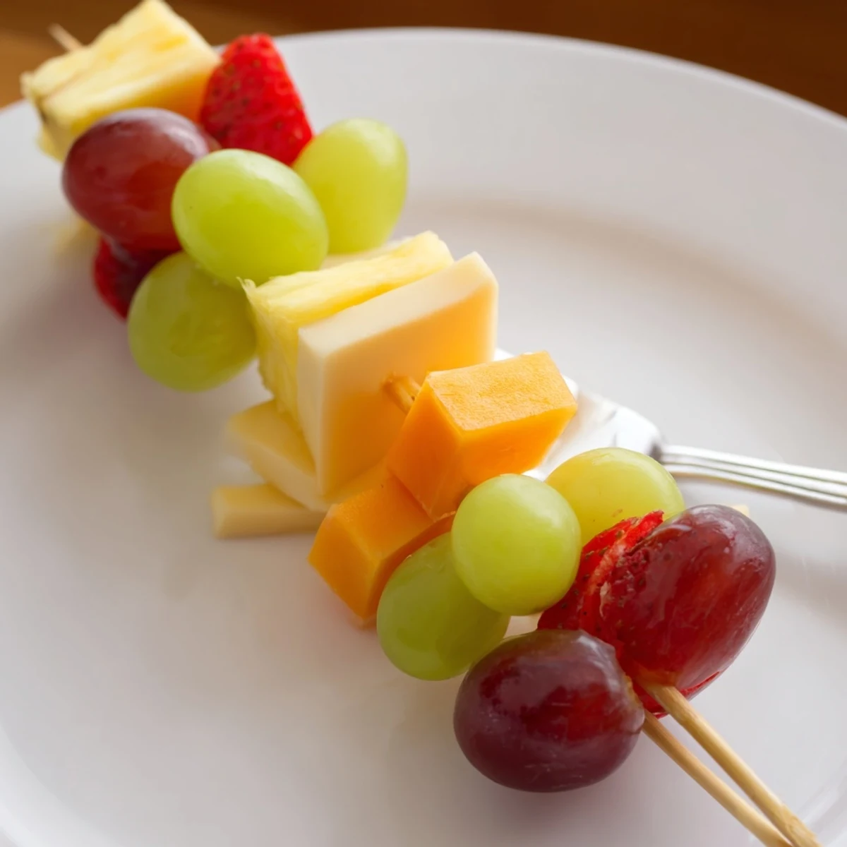 Juicy grapes and strawberries alternate with cheddar cubes on these fruit and cheese kabobs