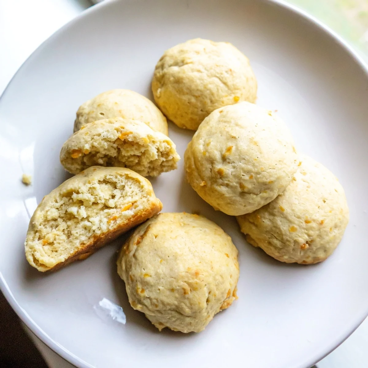 Savory protein biscuits recipe stacked on a wooden board, ready for a nutritious breakfast or on-the-go morning snack