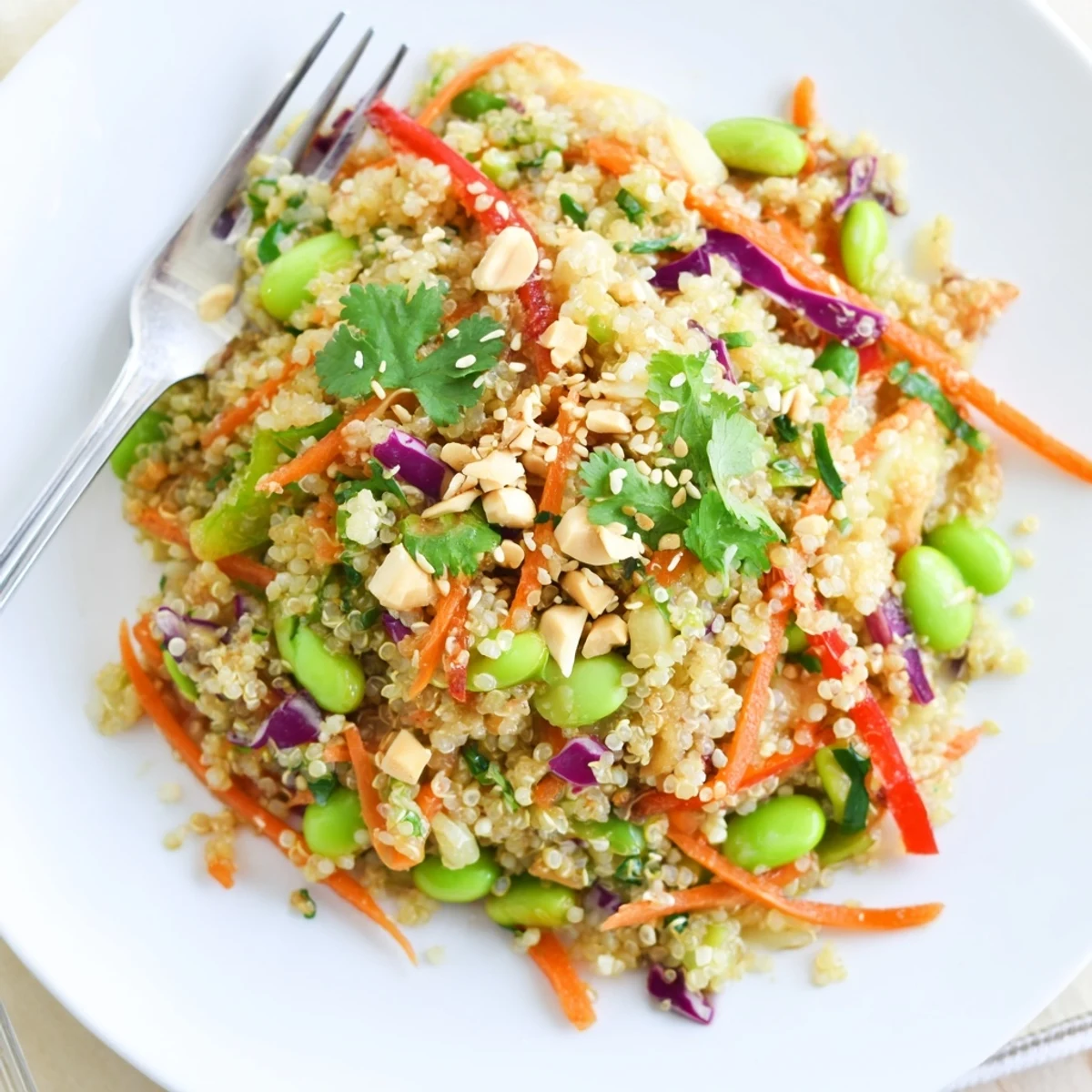 Bowl of Asian Dressing Quinoa Salad with fluffy quinoa, crisp vegetables, toasted sesame