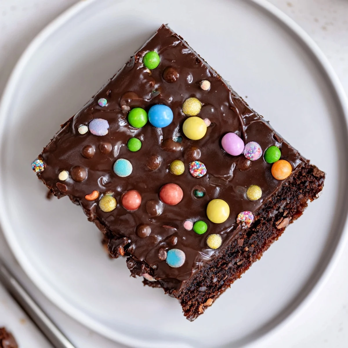 Gourmet Cosmic Brownies Bars with glossy ganache and rainbow sprinkles, fudgy center