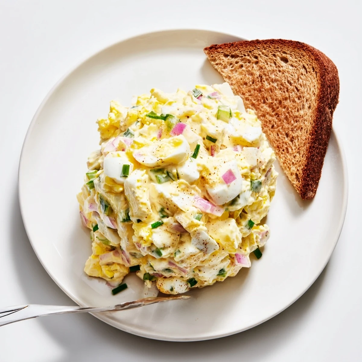 Bright, tangy Classic Egg Salad Recipe speckled with paprika, perfect for sandwiches