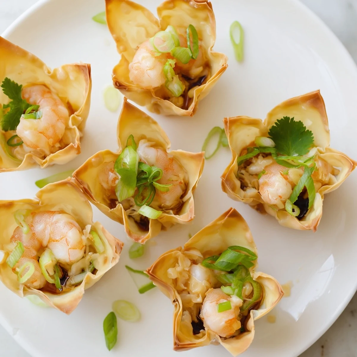 Warm flaky shells, tangy lime dollop adorning Crispy Shrimp Wonton Cups With Lime Cream
